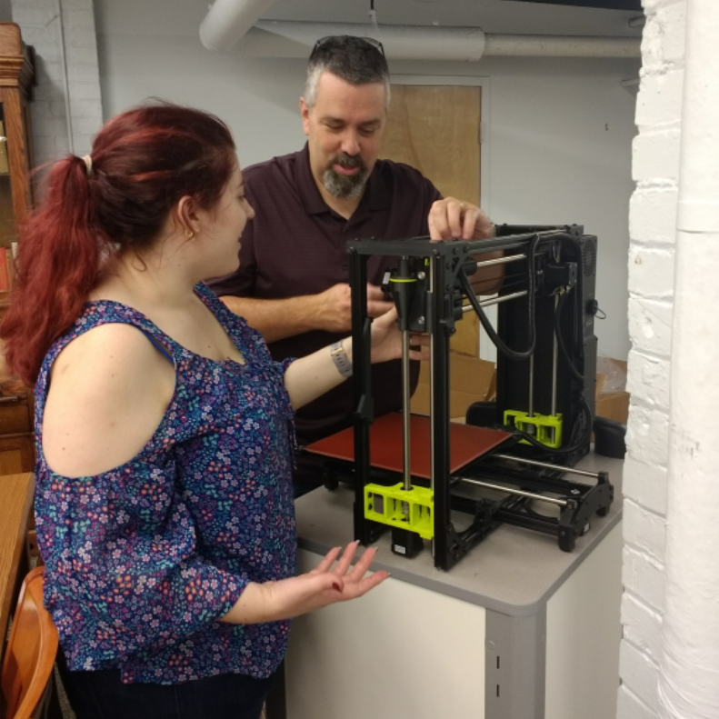 Liz Koziell and Dan Ward set up 3D Printer